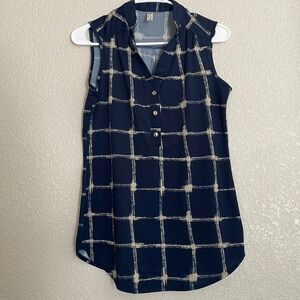 Woman’s navy blue, sleeveless top with buttons size small used in good condition